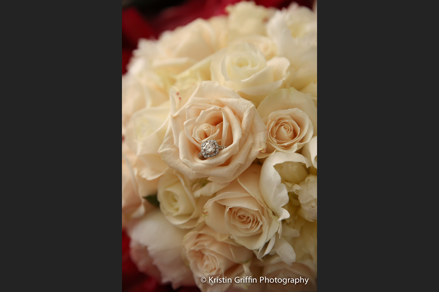 Bouquet of white roses with wedding ring by Stapleton Floral Design
