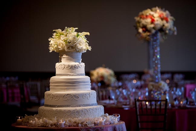 wedding cake with white flowers on top by Stapleton Floral Design