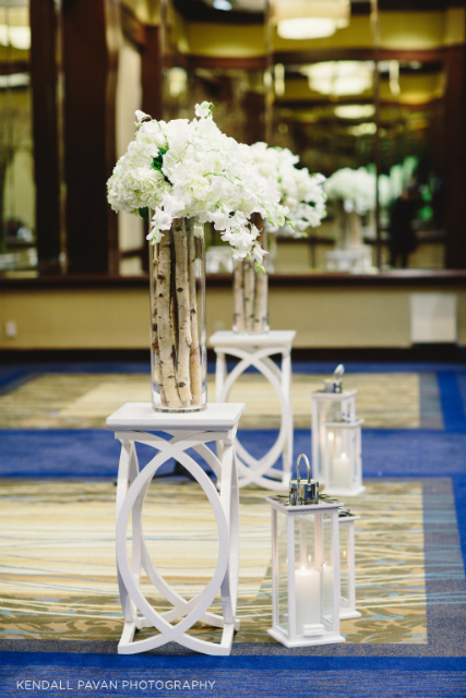 White flowers with birch poles wedding centerpiece by Stapleton Floral Design