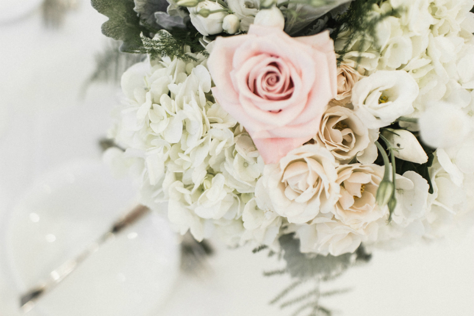 rustic floral arrangement with pink and cream roses