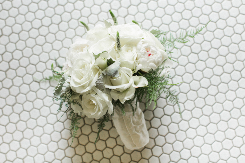 round and simple bridal bouquet with white roses