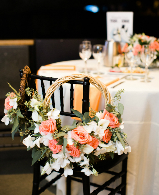 Wedding chairs decorated with floral rings