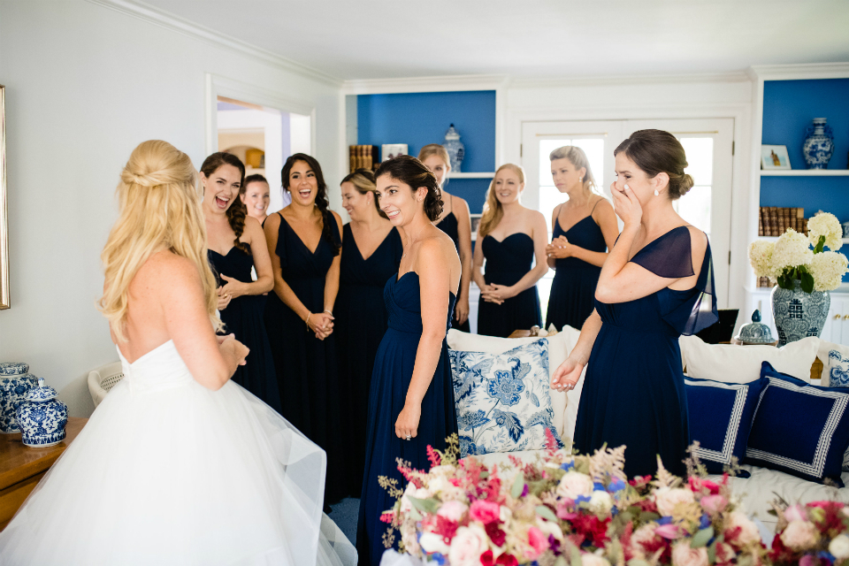 First time bridesmaids saw bride with her wedding dress