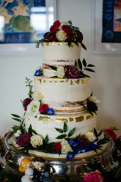 Beautiful wedding cake with flowers on top