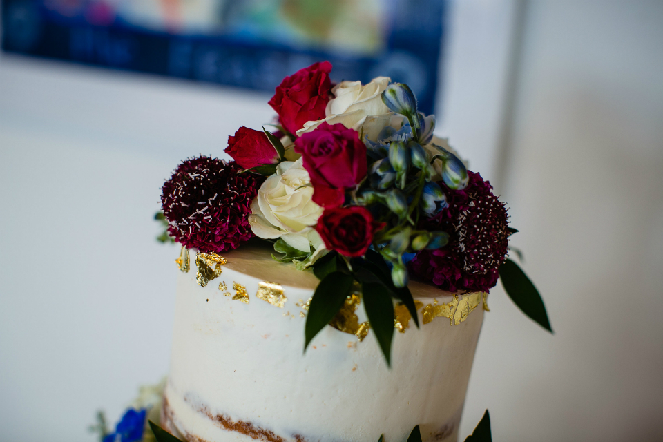 Floral topper on wedding cake