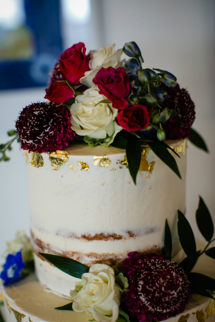 Wedding cake with floral toppers