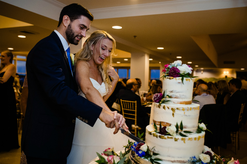 Bride and groom cutting the cake