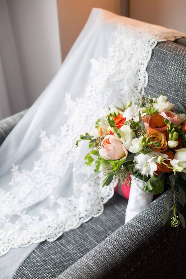 Wedding bouquet with orange roses