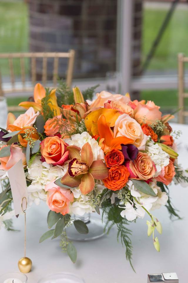 Orange color scheme wedding florals