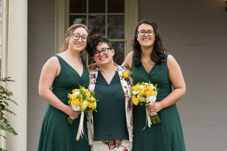 Bridesmaid wearing forest green dresses