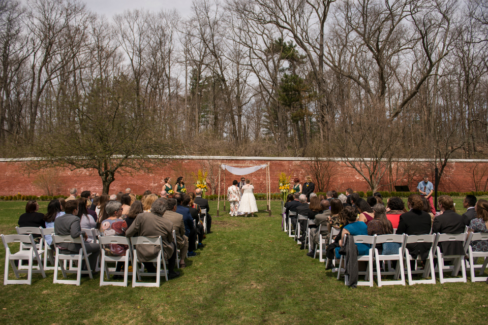Spring wedding ceremony outside of Lyman Estate