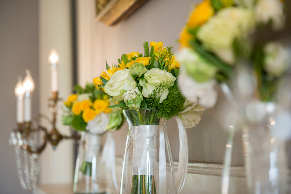 Simple bridesmaid bouquet with yellow roses and accents of greenery by Stapleton Floral Design