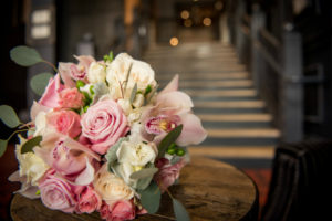 Stunning round bridal bouquet in hues of dusty rose and mauve blossoms by Stapleton Floral Design