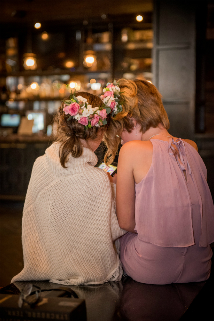 Flower girls wearing pink and white floral headpieces