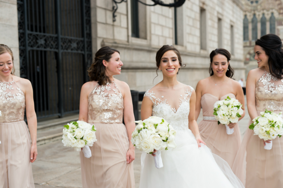 bridesmaids wearing neutral dresses