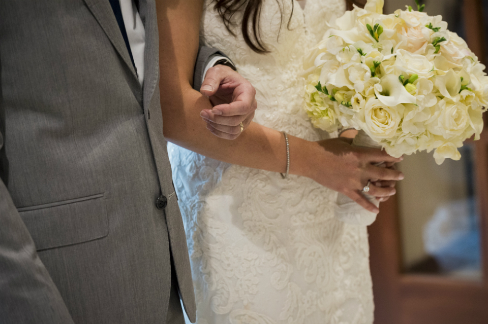 Bride and groom walking down the aisle in a church