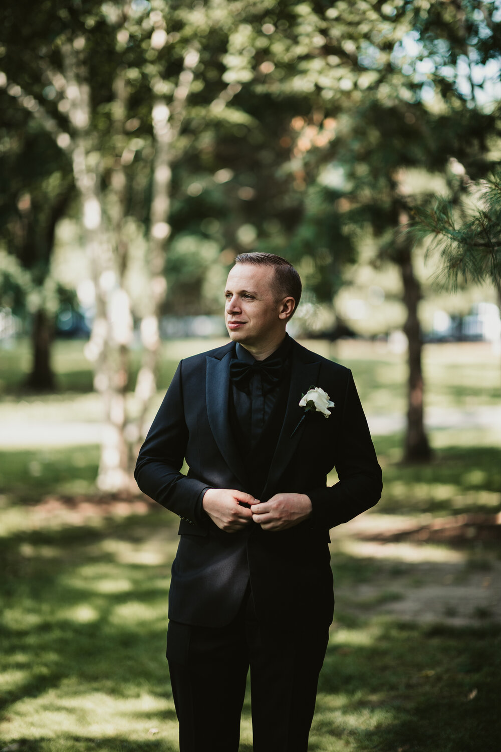 Groom wearing a white boutonniere