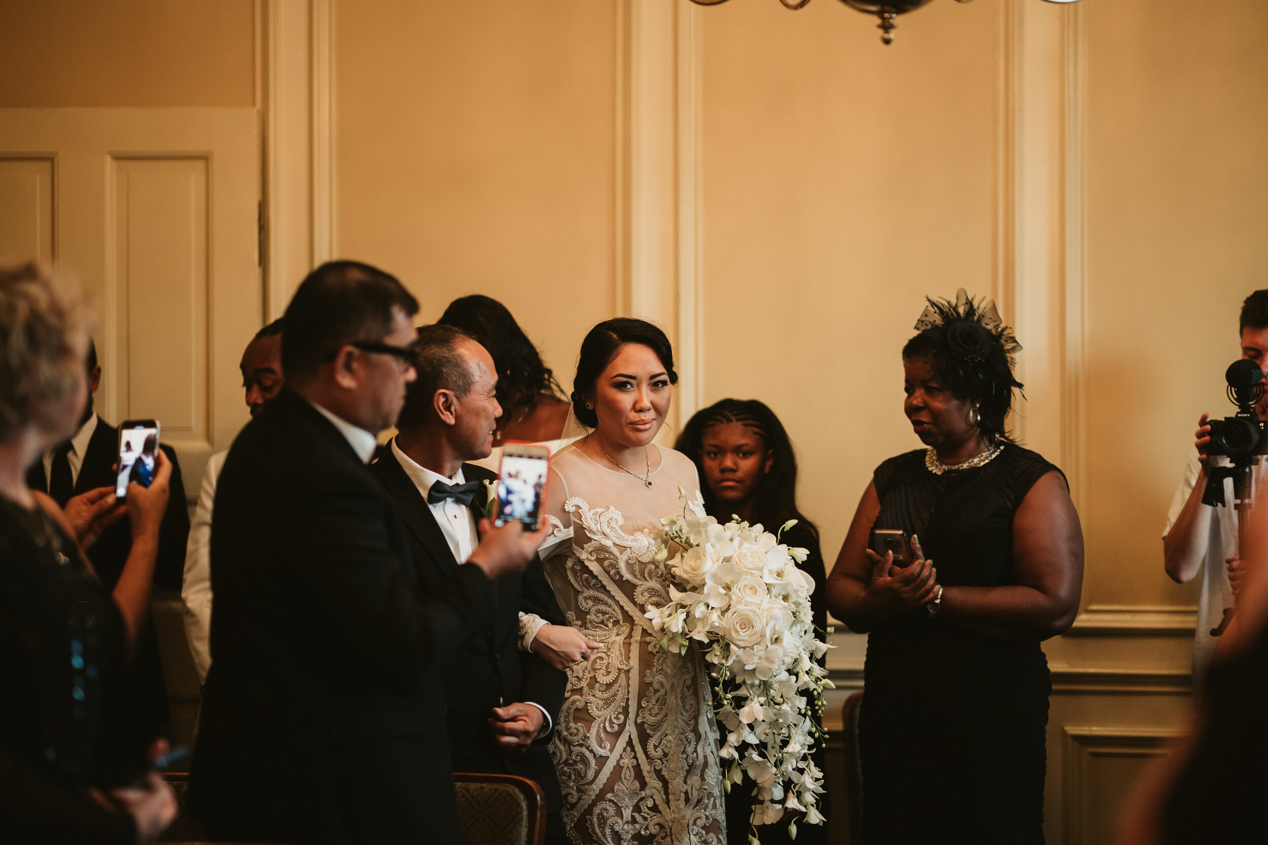 Bride walking down the aisle at Revere Hotel Boston Common