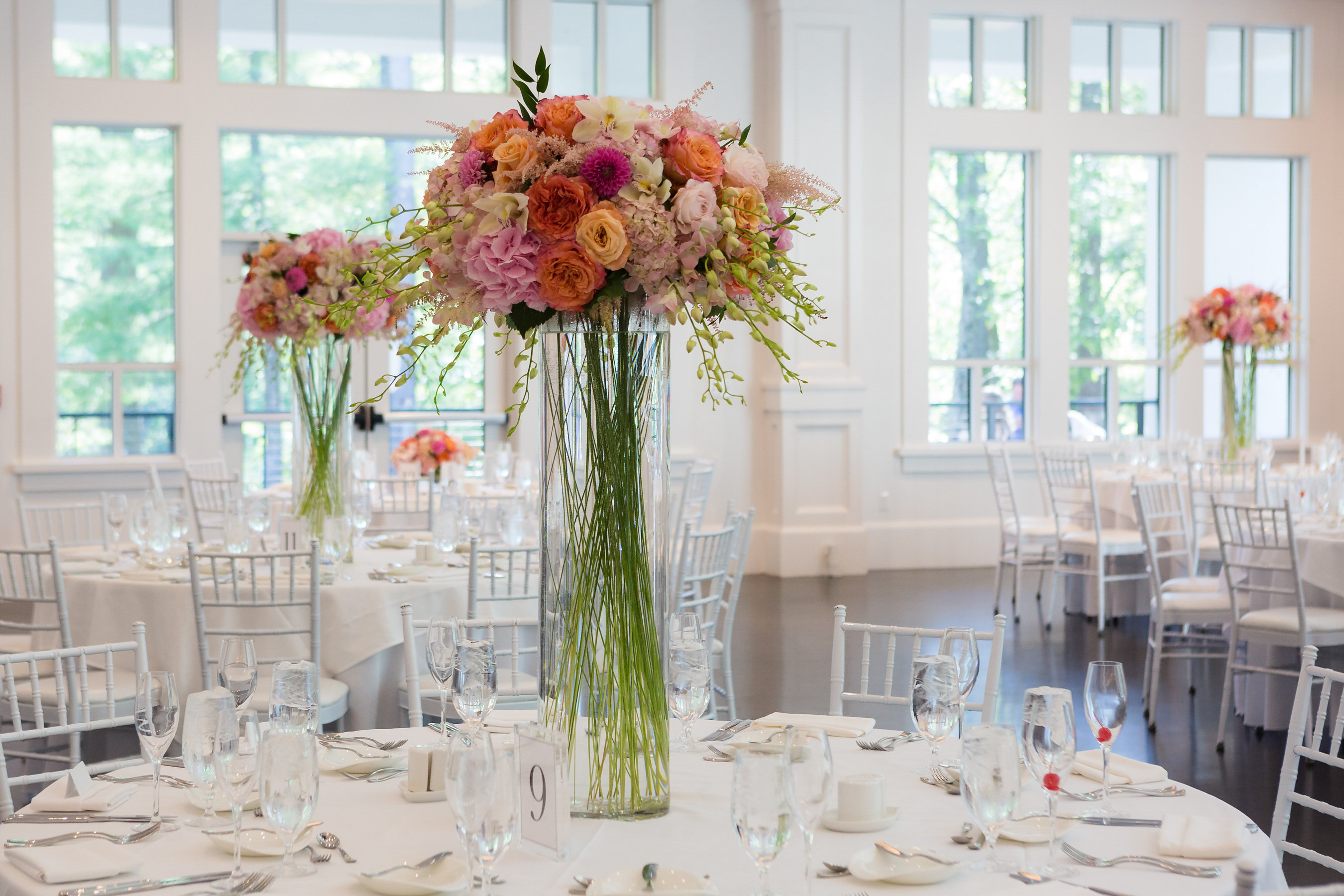 Tall wedding centerpieces with pink and orange flowers