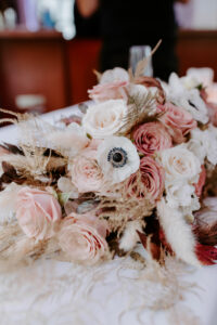 Elegant bridal bouquet with hues of white, cream, and browns by Stapleton Floral