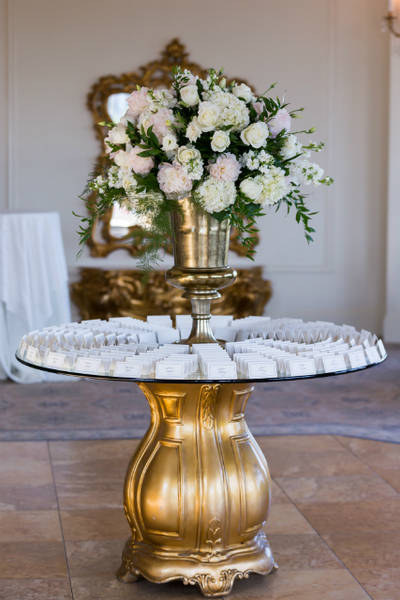 wedding seating chart table with white roses