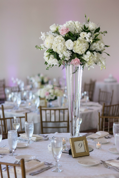 Granite Links Golf Clud wedding reception table with tall centerpieces with white and light pink roses