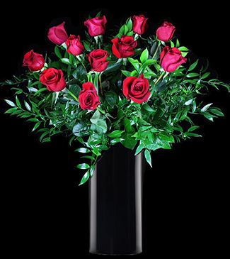 luxurious long stem red roses in a tall black vase