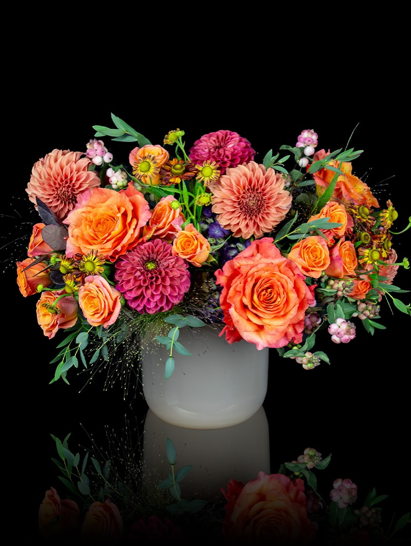 Harborside Harvest floral arrangement by Stapleton Floral featuring dahlias and roses in a white vase
