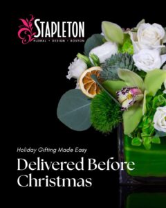Holiday floral arrangement by Stapleton Floral highlighting same-day delivery before Christmas in a modern green glass vase.